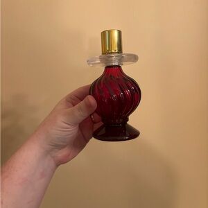 vintage Avon ruby red swirl glass perfume bottle and candlestick holder